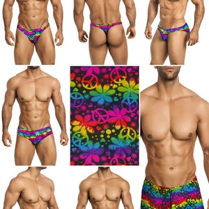 May include: A set of men's swimwear featuring a rainbow tie-dye print with peace signs and flowers. The swimwear includes a thong, a brief, and a pair of swim shorts.