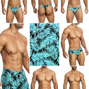 Op de afbeelding: Een collectie zwemkleding met een zwarte achtergrond en een herhalend patroon van heldere cyaankleurige palmbladeren. De set bevat diverse modellen zoals slips, zwembroeken en shorts, allemaal voorzien van dezelfde tropische print.