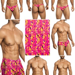 Op de afbeelding: Een collectie zwemkleding met een levendig, abstract patroon in tinten felroze, heldergeel en dieppaars. De set bevat verschillende stijlen zoals slips, zwembroeken en shorts, die allemaal hetzelfde kleurrijke, wervelende ontwerp vertonen.