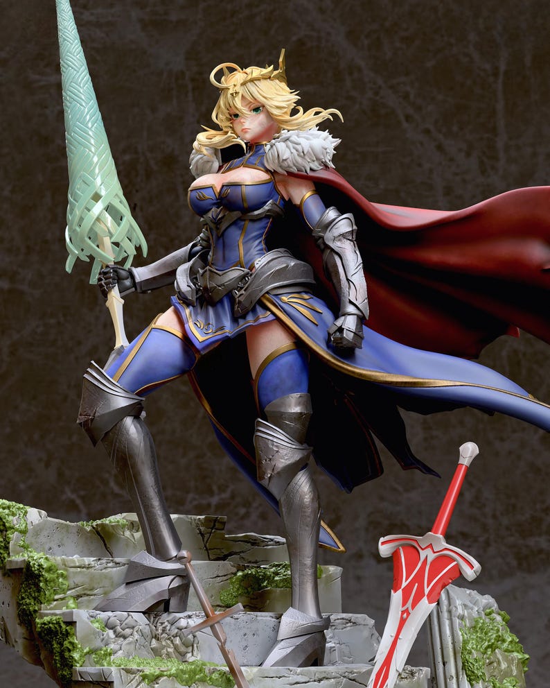 May include: A blue and gold-trimmed figure of a female warrior with blonde hair, wearing a red cape and holding a green spear. She is standing on a stone platform with a red sword lying on the ground beside her.