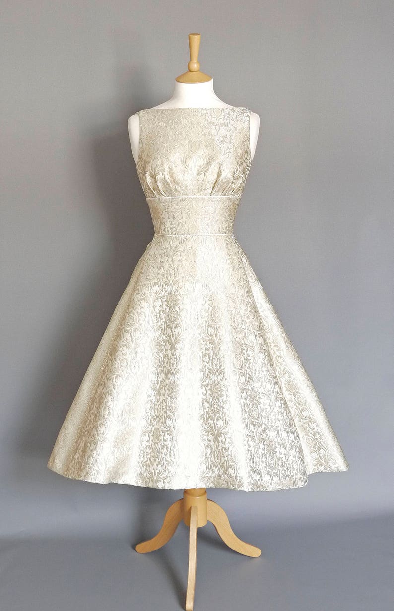 60s Wedding Dresses | 70s Wedding Dresses     Silver and Pearl Brocade Tiffany Wedding Dress with Dipped Hem  - Made by Dig For Victory  AT vintagedancer.com