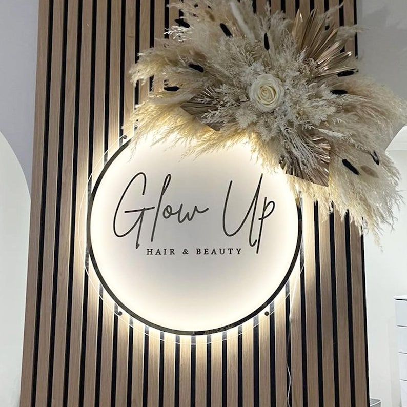 A Round personalized custom LED sign for salon business featuring elegant illuminated logo and text