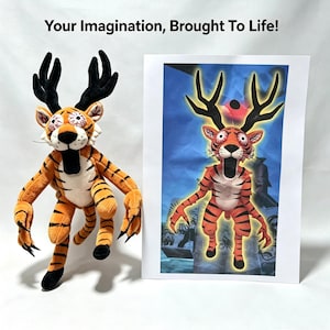 May include: A plush toy featuring a tiger-like creature with black antlers, wide bloodshot eyes, and a gaping black mouth. Beside it is a printed image of the same character with the text "Your Imagination, Brought To Life!" above.