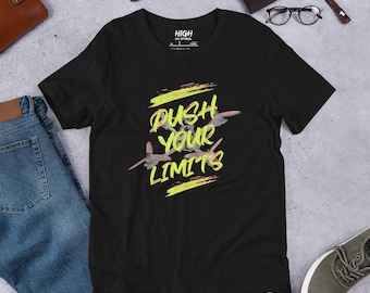 May include: Black t-shirt with a yellow graphic that says "PUSH YOUR LIMITS" with a stylized image of three airplanes.