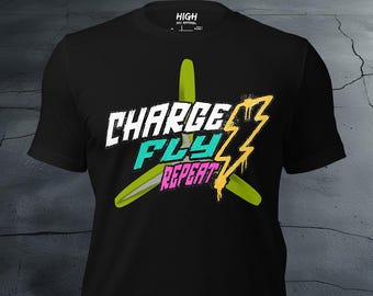 May include: Black t-shirt with a yellow, green, and blue graphic design of a propeller with the text "CHARGE FLY REPEAT" and a lightning bolt.