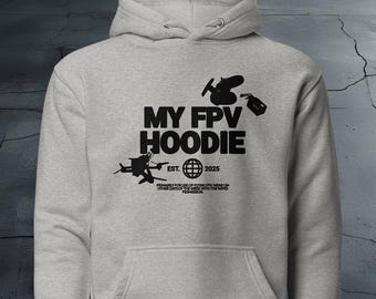 May include: A gray hoodie with a black graphic of a drone and the text "MY FPV HOODIE EST. 2025" printed on the front.
