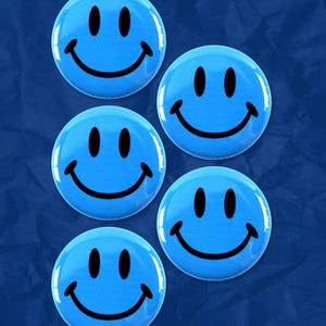 May include: Five blue smiley face buttons with black outlines. The buttons are arranged in a vertical line.
