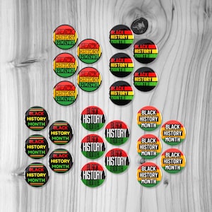 May include: Twenty-four round buttons with the text "Black History Month" in black, red, and green. The buttons are arranged in a grid pattern on a woodgrain background.
