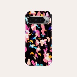 May include: A black phone case with a colorful abstract design. The pattern features brushstrokes in pink, orange, blue, and white. The case has a camera cutout at the top.