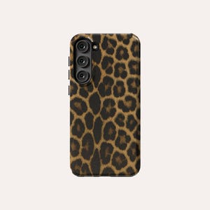 May include: A black phone case with a leopard print design.