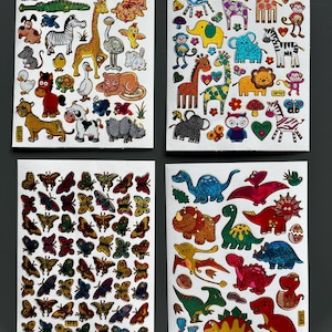 May include: Four sheets of stickers featuring various designs. One sheet has colorful butterflies, another has dinosaurs, and the other two feature animals like lions, giraffes, and zebras. The stickers are on a white background.