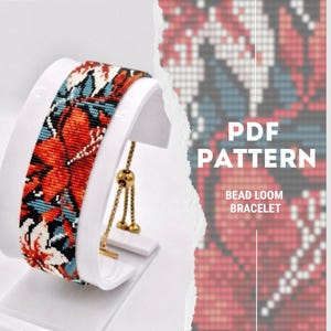 May include: A beaded loom bracelet featuring a floral design in red, white, and blue. The bracelet is presented on a white stand. The image also includes the text "PDF PATTERN" and "BEAD LOOM BRACELET".