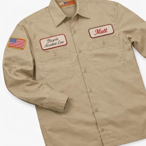 May include: A white ceramic mug with a black handle and the text "But First, Coffee" in a handwritten style. The mug is on a white surface. The mug is likely for hot beverages.