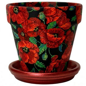 May include: A hand-painted flower pot with a matching saucer. The pot is black and covered in vibrant red poppy flowers with green leaves. The saucer is a matching red color. A decorative item for the home or garden.