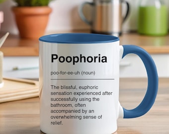 May include: White ceramic mug with a blue interior and handle. The mug features the word "Poophoria" in black, along with a definition. The definition describes a euphoric sensation after using the bathroom.