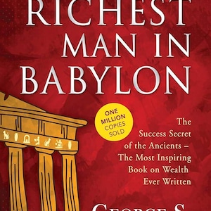 May include: Book cover for "The Richest Man in Babylon" by George S. Clason. The cover is red with white text. A gold circle states "One Million Copies Sold". A gold illustration of a building is at the bottom.