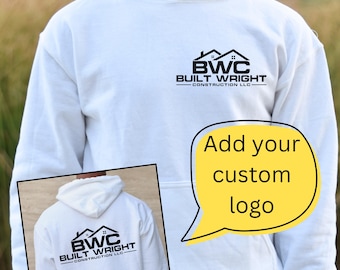 May include: White hooded sweatshirt with a black logo that says "BWC Built Wright Construction LLC" on the front. The back of the sweatshirt has the same logo. A yellow speech bubble says "Add your custom logo".