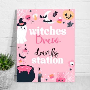 May include: Pink Halloween-themed sign with the words "witches Brew drinks station." The sign features illustrations of a ghost, bats, a pumpkin, a cauldron, and other Halloween-related graphics.