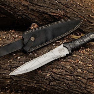 Leon Kennedy knife replica from Resident Evil with wooden handle and steel blade.