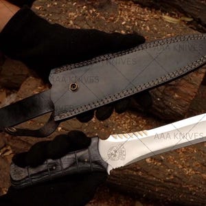 "Handcrafted Leon Kennedy-style knife displayed with gaming collectibles"