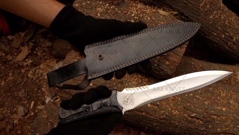 "Handcrafted Leon Kennedy-style knife displayed with gaming collectibles"
