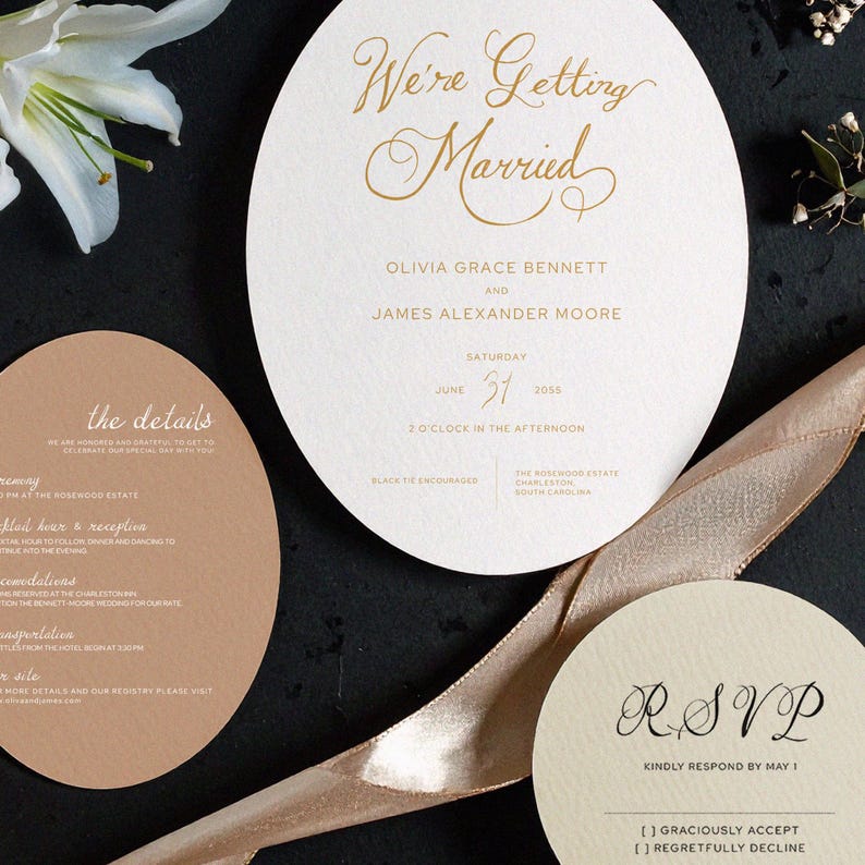 May include: Elegant wedding invitation suite featuring a large, round invitation with gold script that reads "We're Getting Married." Includes RSVP, details, and a ribbon. The date is June 31, 2055.