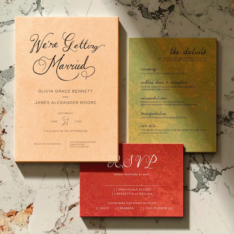 May include: Wedding invitation suite with three cards. The main card reads "We're Getting Married" with the couple's names and date. A second card details the ceremony, reception, and accommodations. The RSVP card is red with dinner selection options.