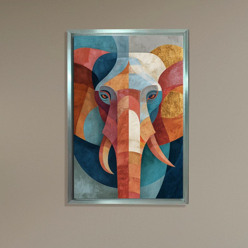 May include: Geometric elephant art print in a silver frame. The artwork features a colorful, abstract design with shades of blue, orange, red, and gold. The elephant's face is the focal point, with large ears and tusks.