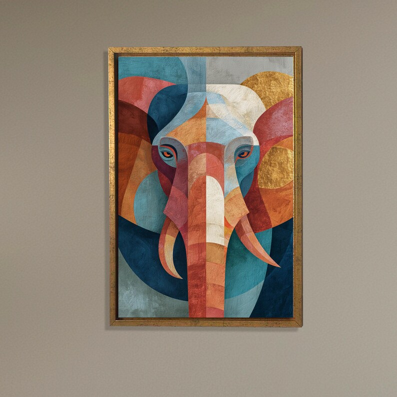May include: Geometric elephant art print in a gold frame. The artwork features a stylized elephant head with a symmetrical design. The color palette includes shades of blue, orange, red, and gold, creating a vibrant and eye-catching piece.