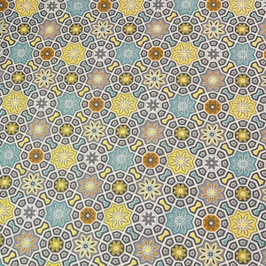 May include: A repeating pattern of geometric shapes in shades of yellow, blue, brown, and gray. The pattern is made up of stars, circles, and squares.