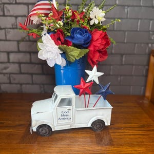 Patriotic floral arrangement and truck