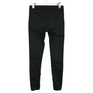 May include: A pair of solid black denim jeans shown from the back view. The pants feature a standard waistband with belt loops, two patch pockets on the rear, and a slim-fit leg design. The garment is displayed hanging from a white plastic hanger.