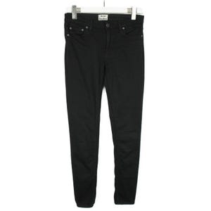 May include: A pair of solid black denim jeans featuring a classic five-pocket design, a button and zipper fly closure, and a white brand label reading Acne Studios stitched onto the interior waistband, all displayed on a white clothing hanger.