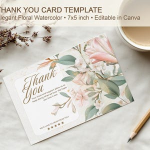 May include: A floral watercolor thank you card template with the text "Thank You". The card features a 7x5 inch design with elegant floral watercolor illustrations and the text "Editable in Canva". A cup of coffee and a pencil are also in the image.