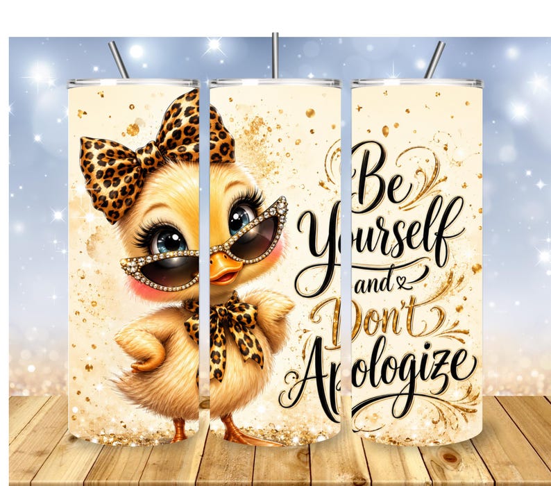 May include: A cylindrical tumbler with a straw featuring a cartoon duck wearing leopard print accessories and rhinestone-studded sunglasses. The design includes gold glitter accents and the black cursive text, Be Yourself and Don't Apologize.