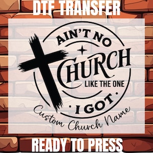 May include: A black DTF transfer graphic featuring a distressed cross and the text AIN'T NO CHURCH LIKE THE ONE I GOT with a space for a custom church name. The design is circular with a star accent, presented as a ready to press heat transfer.