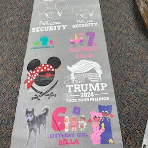 May include: A sheet of printed designs featuring various graphics and text. Designs include "Princess Security," a unicorn, a pirate Mickey Mouse, a husky, and the text "TRUMP 2024 - FUCK YOUR FEELINGS." Other text includes "My 7th Birthday Alexis" and "Birthday Girl Bella."