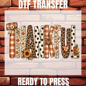 May include: A DTF transfer graphic featuring the word THANKFUL in mixed patterns including orange buffalo plaid, leopard print, and black polka dots. The design includes sunflowers, autumn leaves, a small heart, and bows.