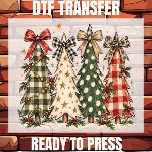 May include: A DTF transfer sheet featuring four stylized Christmas trees with the text DTF TRANSFER and READY TO PRESS. The trees display patterns of green buffalo plaid, gold stars, white polka dots, and red gingham, topped with bows.