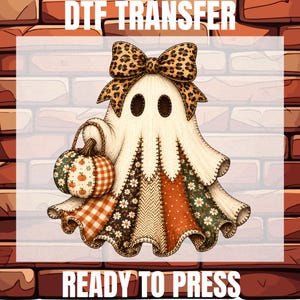 May include: A DTF TRANSFER READY TO PRESS graphic featuring a ghost with a leopard print bow, holding a pumpkin basket. The ghost has a patchwork-style body with floral, plaid, and herringbone patterns in orange, brown, and cream colors.