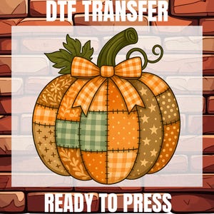 May include: A DTF transfer design featuring a patchwork pumpkin with orange, green, and brown sections. The pumpkin has a green stem, a plaid bow, and the words "DTF TRANSFER" and "READY TO PRESS" in white text.