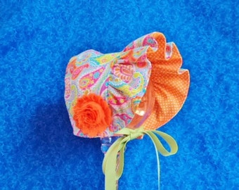 Tangerine Baby Bonnet with Paisley Reversible Bonnet to Orange and White Polka Dots