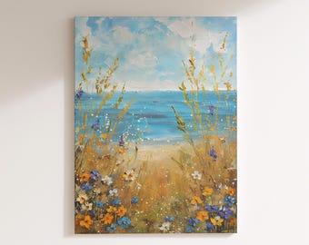 Puede incluir: Pintura al óleo de una escena costera. La obra representa un océano azul brillante bajo un cielo nublado. Altas hierbas doradas y coloridas flores silvestres enmarcan la vista, creando una sensación de profundidad y tranquilidad. La pintura está sobre lienzo.