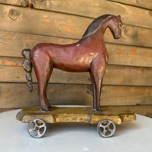 vintage wooden horse on wheels: antique pull toy