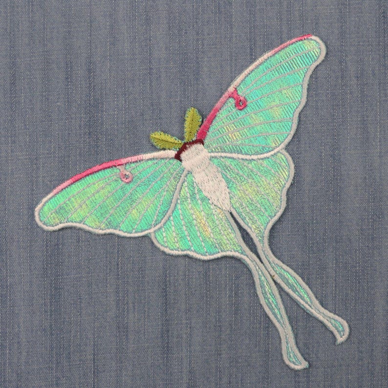 Iridescent turquoise iron-on embroidered Luna moths patch, suitable for decorating clothes, jackets, and bags, ideal for DIY projects.jpg