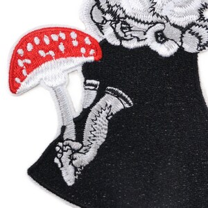 Embroidered rabbit with red toadstool patch in rockabilly and folklore style, iron-on applique for jackets, bags, or clothing.jpg