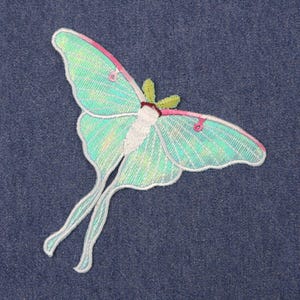 Iridescent turquoise iron-on embroidered Luna moths patch, suitable for decorating clothes, jackets, and bags, ideal for DIY projects.jpg
