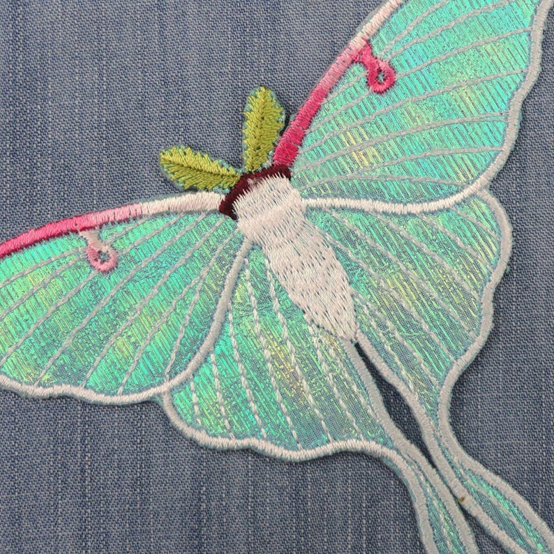 Iridescent turquoise iron-on embroidered Luna moths patch, suitable for decorating clothes, jackets, and bags, ideal for DIY projects.jpg