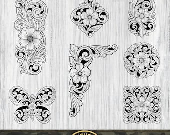 May include: A collection of black and white floral scrollwork designs featuring various shapes including a butterfly, a corner piece, a diamond, a circle, a square, and a rectangular border, all displayed on a light wood grain background with SVG and PNG text.