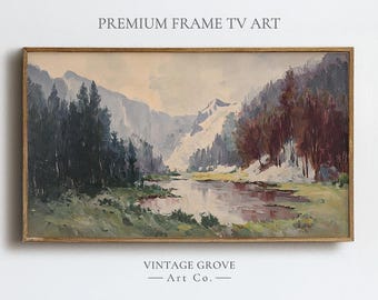 Op de afbeelding: Een ingelijst landschapsschilderij met een rivier die door een vallei kronkelt, met besneeuwde bergen op de achtergrond. Het kunstwerk heeft een vintage esthetiek, met de tekst "PREMIUM FRAME TV ART" en "VINTAGE GROVE - Art Co." zichtbaar.